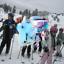 A group of young kids getting ready to ski on a mountain..jpg